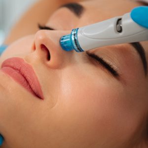 close-up-modern-device-hydrafacial-procedure-used-face-cleansing