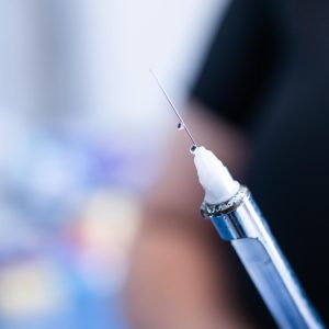 dentist-s-hands-preparing-syringe-giving-dental-anesthesia-her-patient-selective-focus (1)